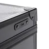 A close-up view of the corner of a black makeup case, showing a USB-C port and two small circular buttons. Voir les images du produit