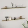 Two shelves mounted on a white wall, each displaying decorative items. Produktbild-Vorschau