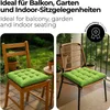 Collage of two images showing green seat cushions on chairs, one wooden and one rattan, on a patio/balcony setting. Produktbild-Vorschau