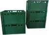 A stack of green plastic crates on a white background. Produktbild-Vorschau