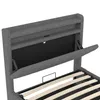 Close-up view of the headboard of a bed, showing storage compartments and USB/Type-C ports. Produktbild-Vorschau