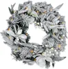 Couronne de sapin avec neige et fleurs blanches - illuminée Voir les images du produit 1