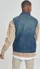 A person wearing a denim vest over a tan hoodie and white t-shirt. Produktbild-Vorschau