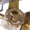 A close-up view of a decorative lamp component, featuring a metallic wheel and wooden elements. Produktbild-Vorschau
