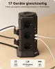 A black power strip tower with multiple outlets and USB ports is shown on a wooden desk. Produktbild-Vorschau