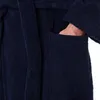 A close-up shot of a person's hand in the pocket of a navy blue robe. Produktbild-Vorschau