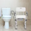A toilet and a shower chair in a bathroom. Náhled obrázku produktu