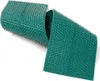 A green acupressure mat with silver spikes is shown against a white background. The mat is partially unrolled, revealing its textured surface and numerous small spikes. Produktbild-Vorschau