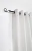 A close-up view of a black curtain rod with white curtains hanging from it. Produktbild-Vorschau