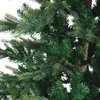 A close-up view of the branches and needles of an artificial Christmas tree. Voir les images du produit