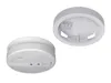 Two views of a white smoke detector and its mounting base, shown against a white background. Produktbild-Vorschau