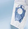 A close-up of a vacuum cleaner dust bag with a blue plastic attachment. Produktbild-Vorschau