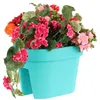 A turquoise balcony planter filled with colorful flowers, set against a white background. Anteprima dell’immagine prodotto