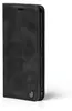A black flip cover phone case is shown in a studio setting against a white background. Produktbild-Vorschau