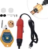 A collection of tools and accessories for a power tool, including a driver, a spring balancer, and various attachments. Voir les images du produit