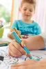 A child and an adult are coloring with pencils. Voir les images du produit