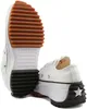 A pair of white Converse Run Star Hike Ox sneakers are shown from a low angle against a white background. The shoes have thick, black, lugged soles and brown rubber soles. Voir les images du produit