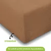 A close-up of a brown fabric, likely a bedsheet, with text overlays and an arrow pointing to a feature. Produktbild-Vorschau