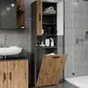 A modern bathroom with a sink, vanity, and a tall cabinet with a laundry basket. Produktbild-Vorschau