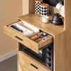 A kitchen cabinet with an open drawer revealing cutlery and a microwave below. Produktbild-Vorschau