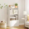 A white bookshelf with items on it, placed in a room with a couch and a side table. Produktbild-Vorschau