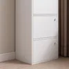 Close-up view of a white cabinet with three doors. Náhled obrázku produktu