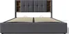 A bed frame with a headboard featuring storage compartments. Produktbild-Vorschau