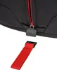 A close-up view of a black backpack zipper with a red pull tab and a detached red strap with a black clip. Produktbild-Vorschau