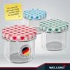 Three glass jars with checkered lids in red, green, and blue, with a yellow sticky note and a brand logo. Produktbild-Vorschau