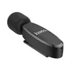A black wireless lavalier microphone with a foam windscreen and a clip. Anteprima dell’immagine prodotto