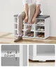 A person is sitting on a shoe bench, tying their shoe. The shoe bench has multiple compartments for shoes, and close-up images of the bench's construction are shown below. Produktbild-Vorschau