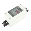 A white electrical distribution box with a transparent lid, showing a red switch inside. Two black connectors are attached to the left side. Náhled obrázku produktu