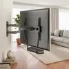 A TV wall mount with a TV attached, shown in a living room setting. Podgląd zdjęcia produktu