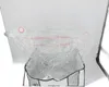A clear plastic vacuum storage bag is shown, partially filled and open at the top, with a gray and white fabric base. Anteprima dell’immagine prodotto