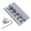 A chrome-finished electric bass guitar bridge with accompanying screws and an Allen wrench, presented on a white background. Podgląd zdjęcia produktu