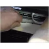 A hand is cleaning the inside of a printer with a white cloth. Produktbild-Vorschau