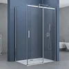A modern bathroom with a glass shower enclosure.