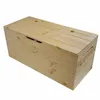 A light brown wooden storage chest with a hinged lid, shown from a three-quarter angle against a white background. Anteprima dell’immagine prodotto