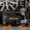 A cordless impact wrench kit with batteries and sockets is displayed in front of a car wheel and a toolbox. Produktbild-Vorschau