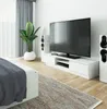 A modern living room or bedroom with a large television and sound system. Produktbild-Vorschau