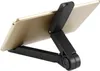 A close-up, angled view of a black tablet stand holding a gold tablet against a white background. Náhľad obrázku produktu
