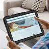A person is holding a tablet in a protective case, looking at a website. Produktbild-Vorschau