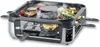 A raclette grill with food cooking on it. Produktbild-Vorschau