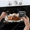 A person is using a digital thermometer to check the temperature of a roast in an oven. Náhľad obrázku produktu