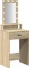 A vanity table with a mirror and lights. Voir les images du produit