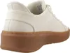 A side view of a white sneaker with a brown sole. Voir les images du produit