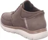 A side view of a brown Skechers slip-on shoe. Náhled obrázku produktu