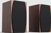 Two wooden speakers with black fronts are shown against a plain white background. Náhled obrázku produktu