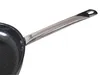 A close-up shot of a frying pan handle and part of the pan's interior. Produktbild-Vorschau