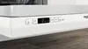 Close-up of a white dishwasher control panel with a digital display and buttons. Voir les images du produit